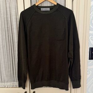 Stylish and comfortable green long sleeve shirt. Perfect for any occasion.